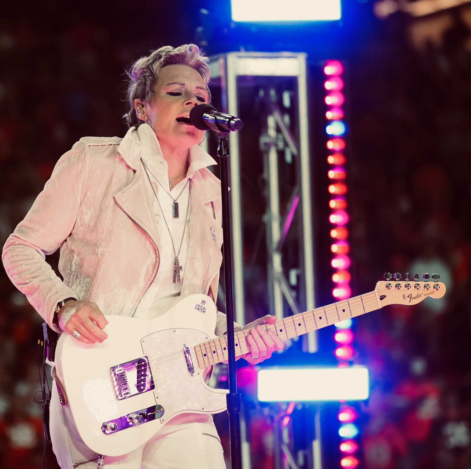 Anita Cochran singing and playing her white Fender Telecaster live on stage